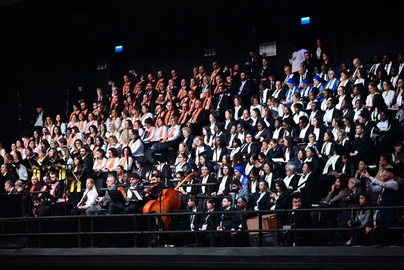 A 200-member international choir and orchestra performing during Pope Leo XIV’s public Mass at Volkswagen Arena in Istanbul.