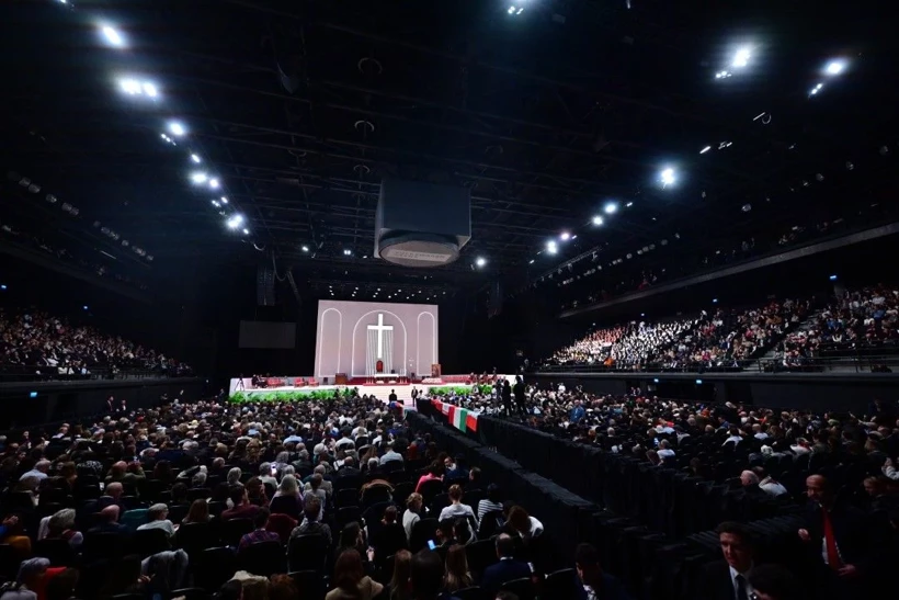 Wide view of the full crowd attending Pope Leo XIV’s public Mass at Volkswagen Arena.