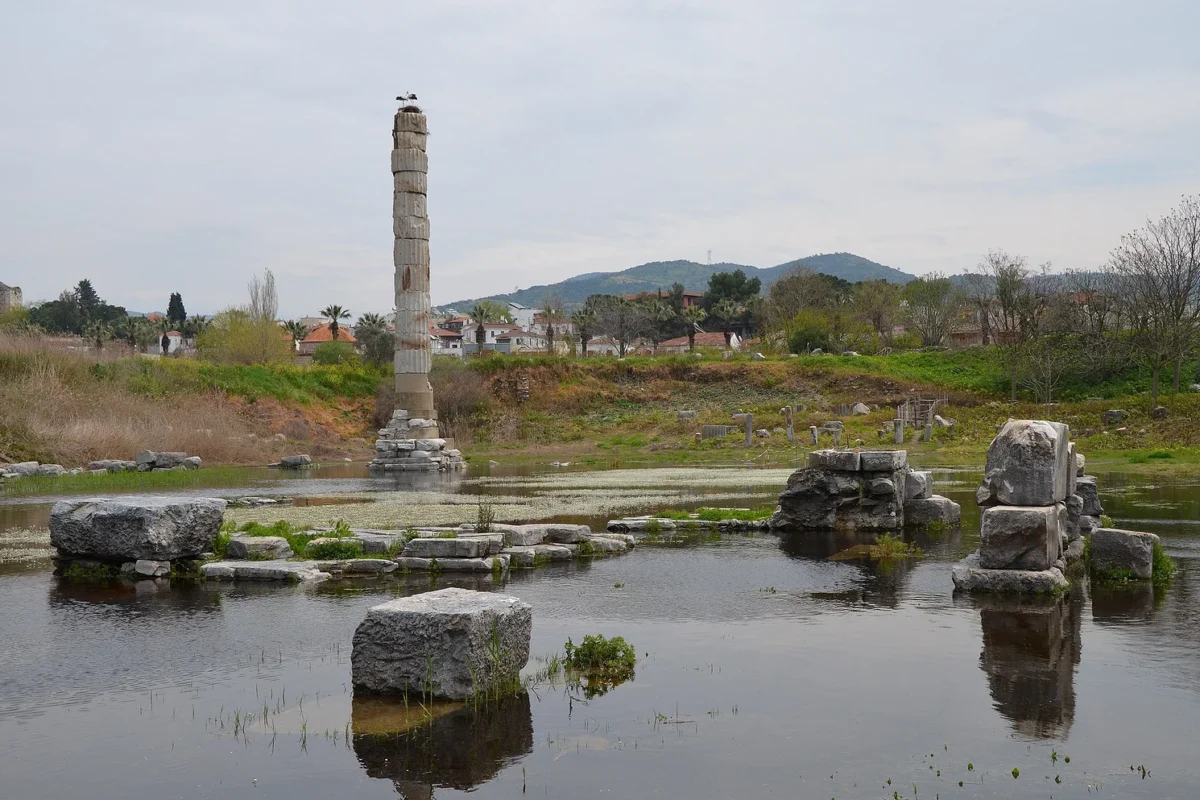 Temple of Artemis ruins with a single standing column and reflecting pool in Ephesus, one of the Seven Wonders.